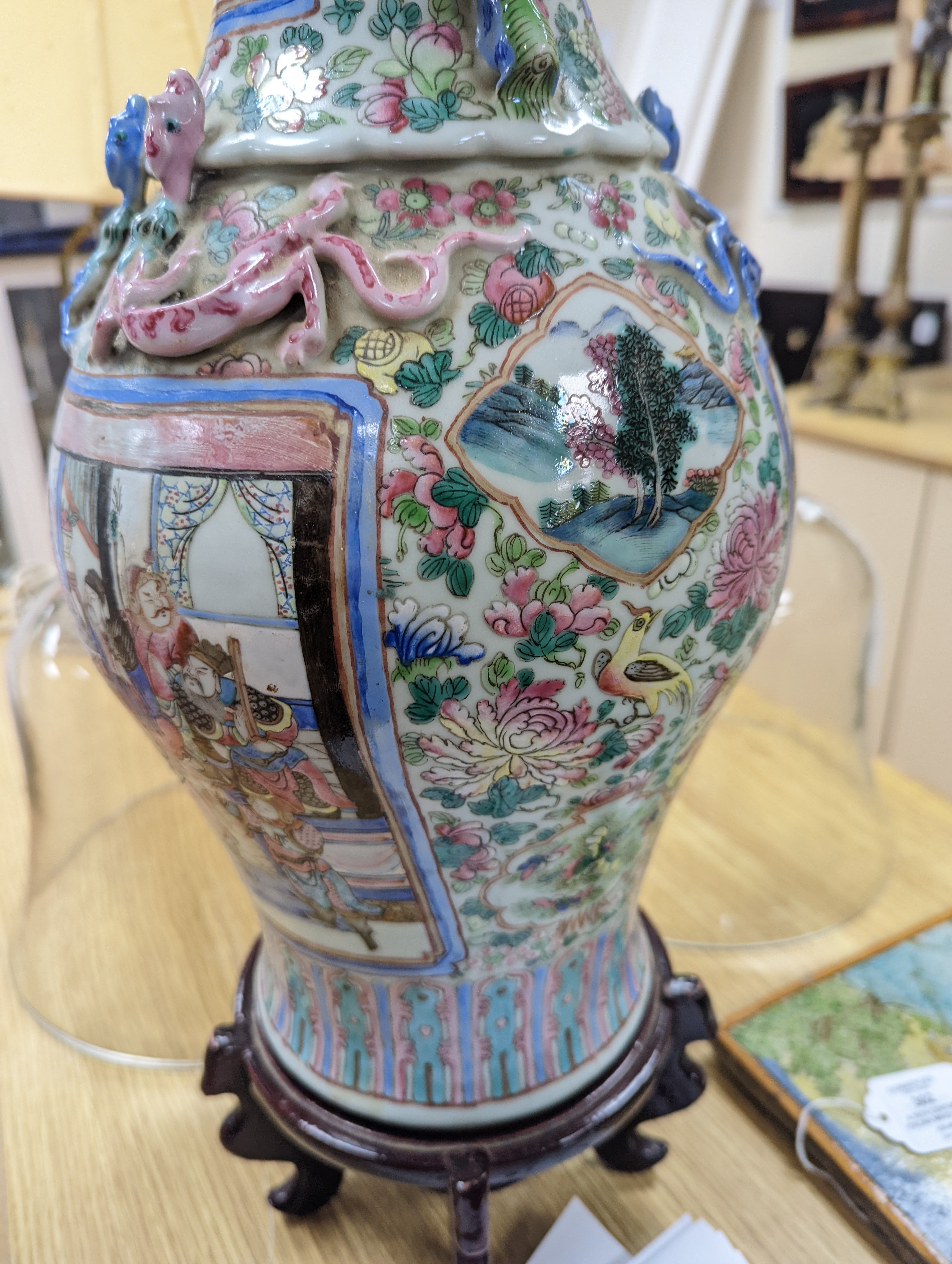 A large Chinese famille rose two handled vase, late 19th century, wood stand, restored 54cm incl stand